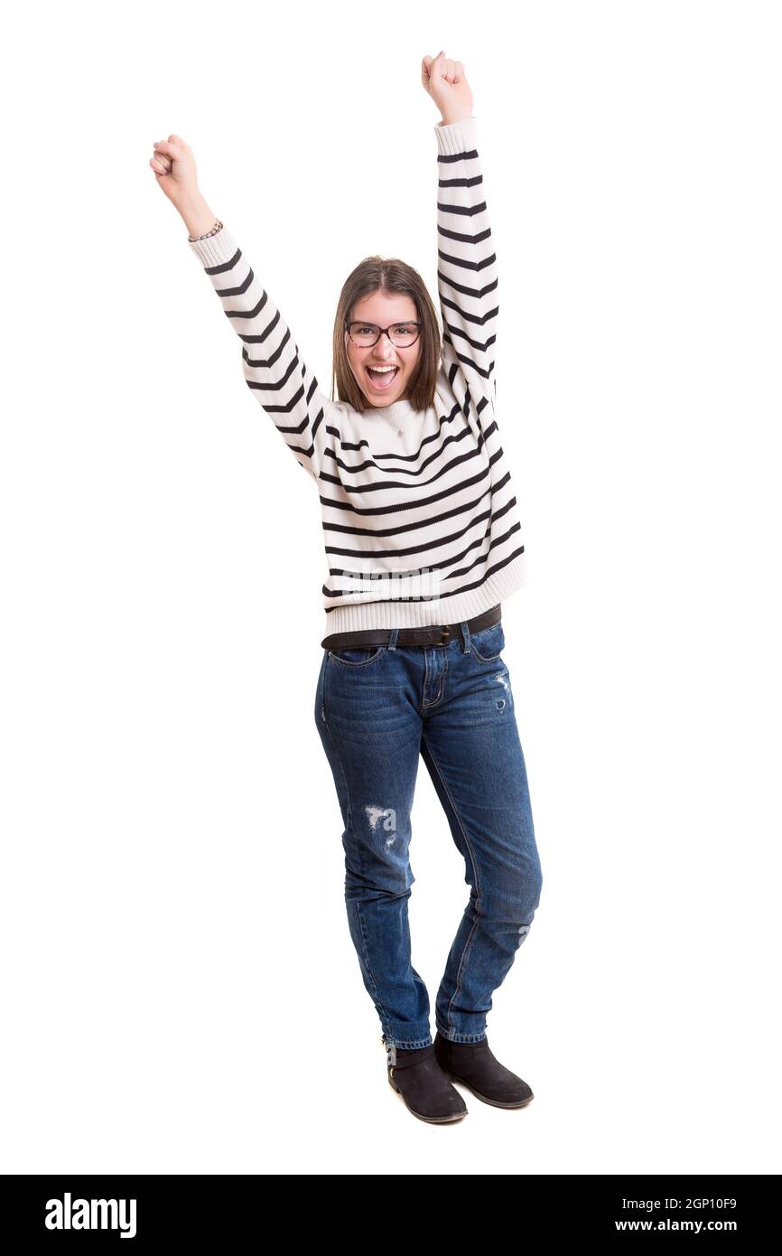 Studio shot: Happy woman with raised arms Stock Photo - Alamy