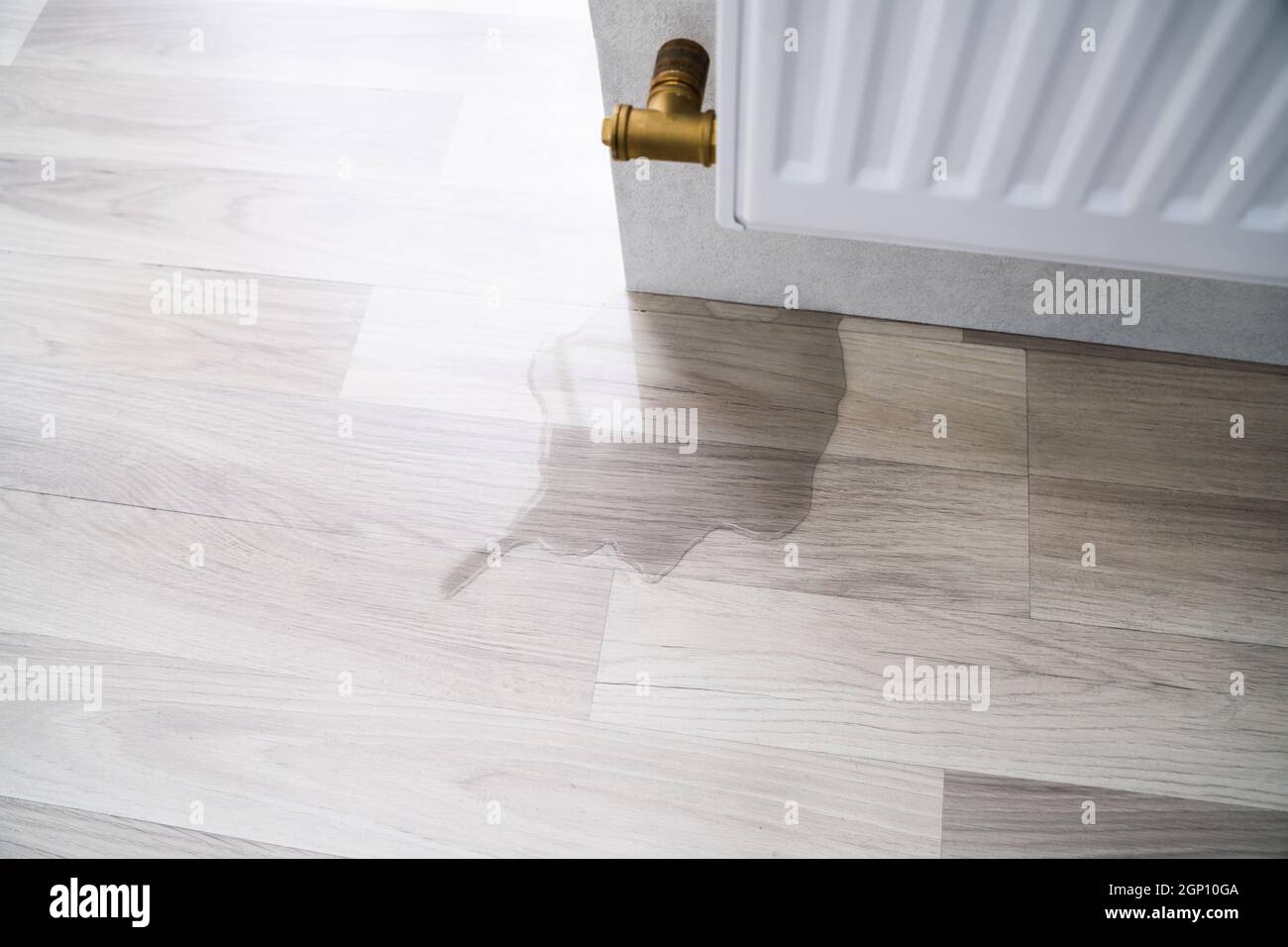 Laminate Floor Damage In Room After Heating Pipe Leakage Stock Photo