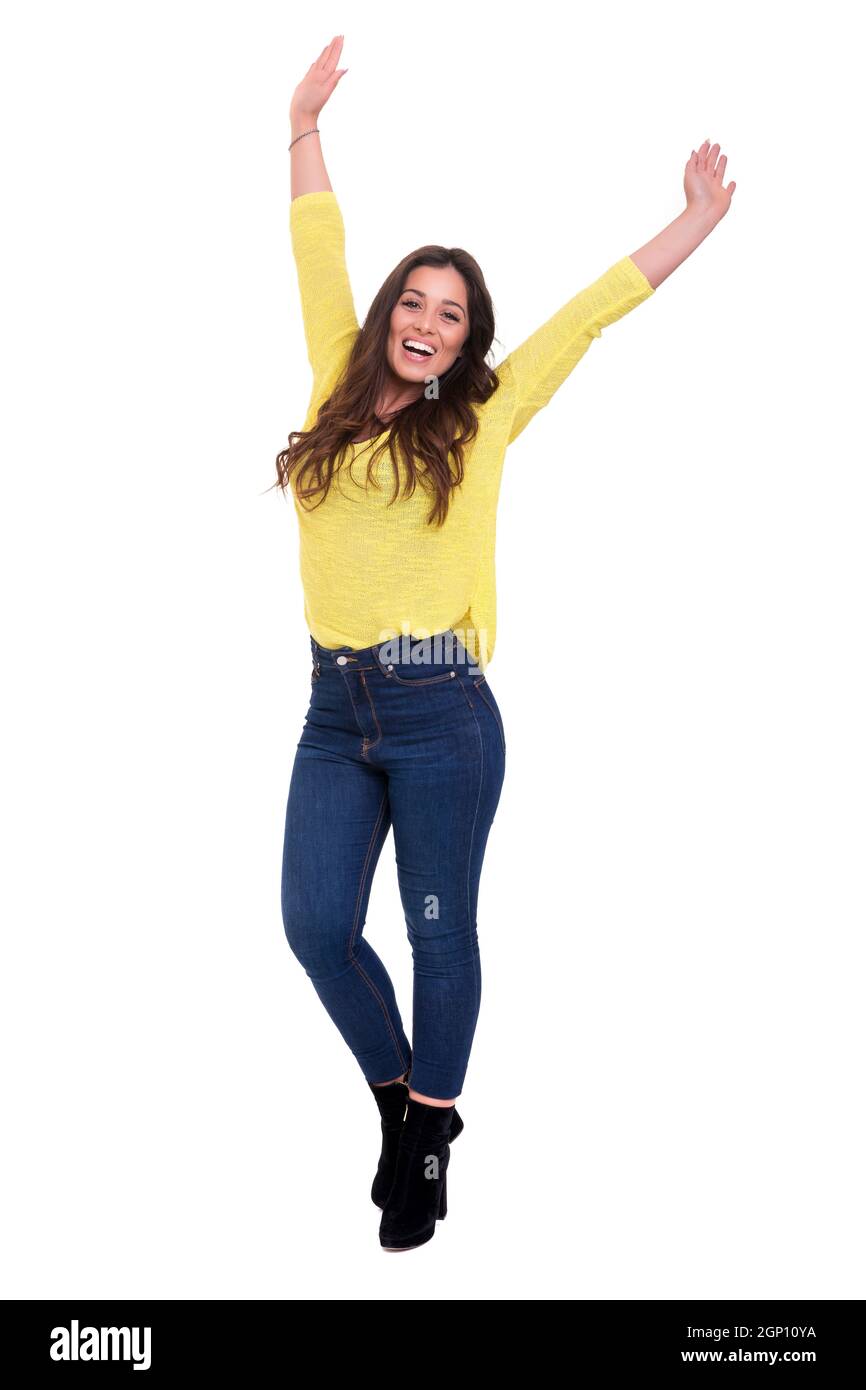 Studio shot: Happy woman with raised arms Stock Photo - Alamy
