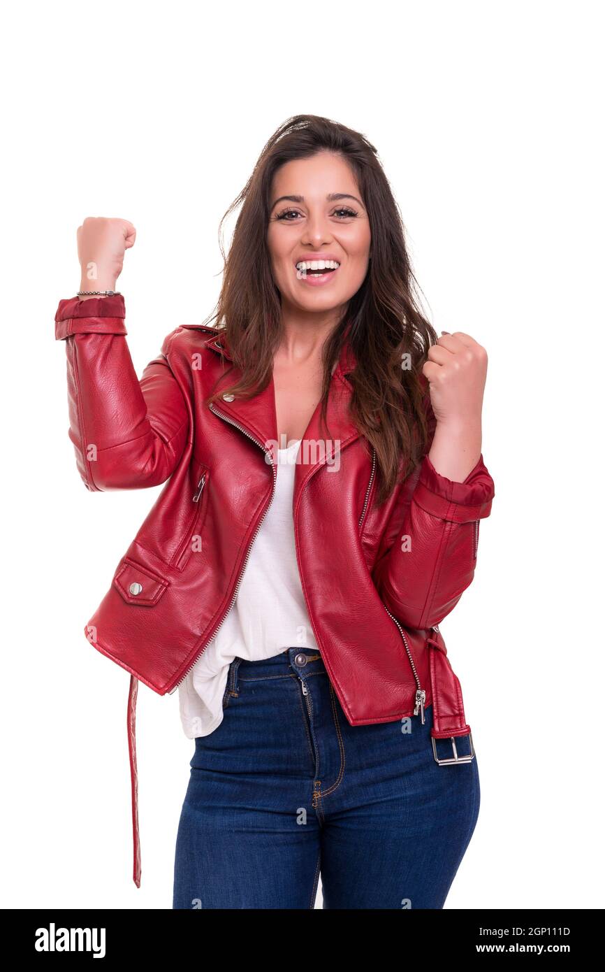 Studio shot: Happy woman with raised arms Stock Photo - Alamy