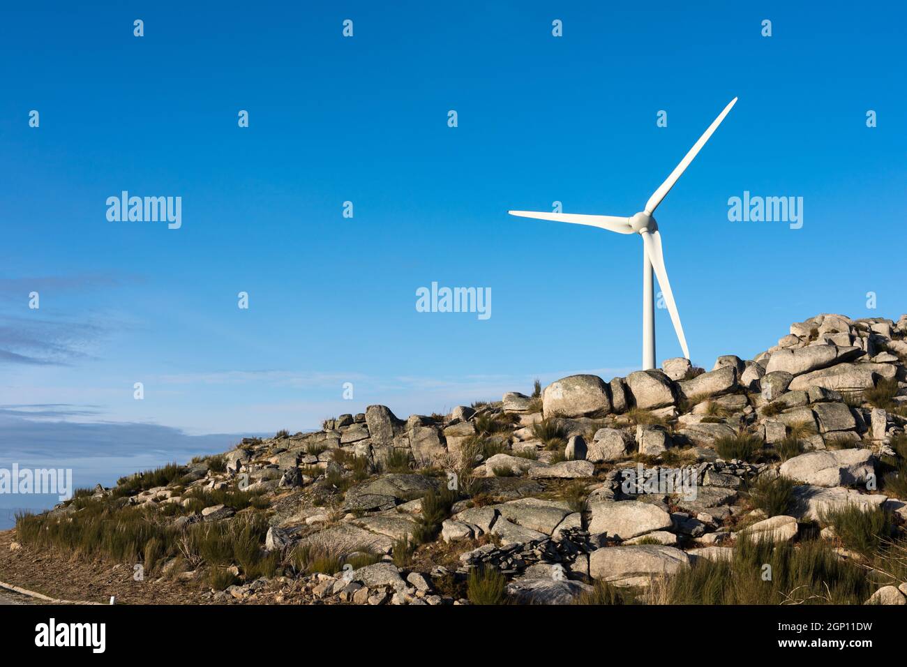 Wind energy turbines, in a landscpae over a beautiful blue sky Stock ...