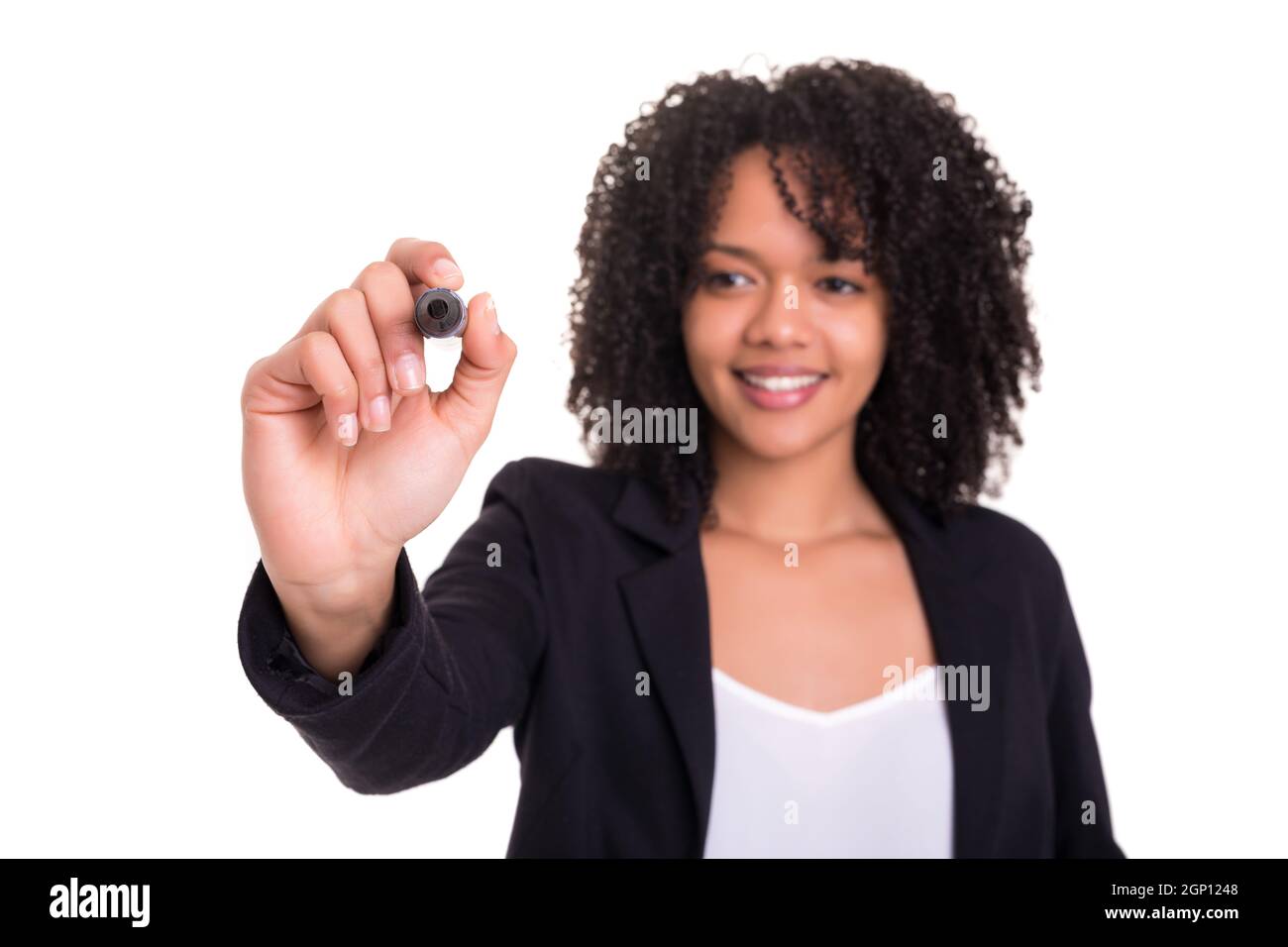 A beautiful african business woman writing with marker on virtual ...