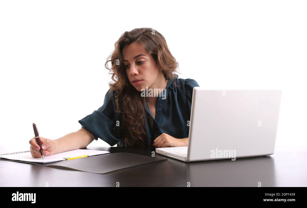 Young beautiful girl working with laptop, isolated over white Stock ...