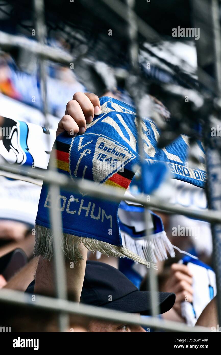 Vonovia Ruhrstadion Bochum, VfL Bochum fans hold up their fan scarves. Stock Photo