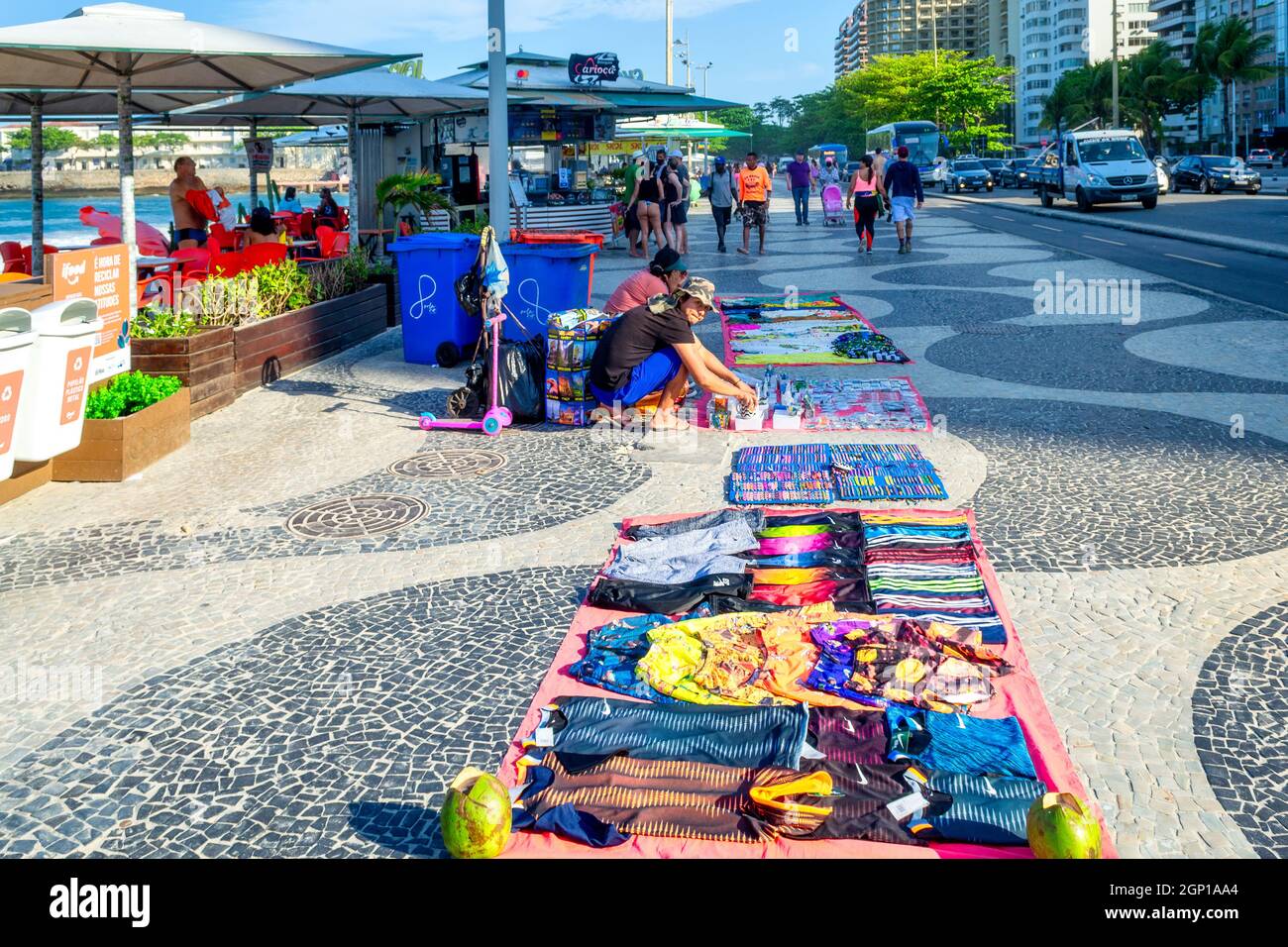 People selling souvenirs in the promenade of the Copacabana Beach in
