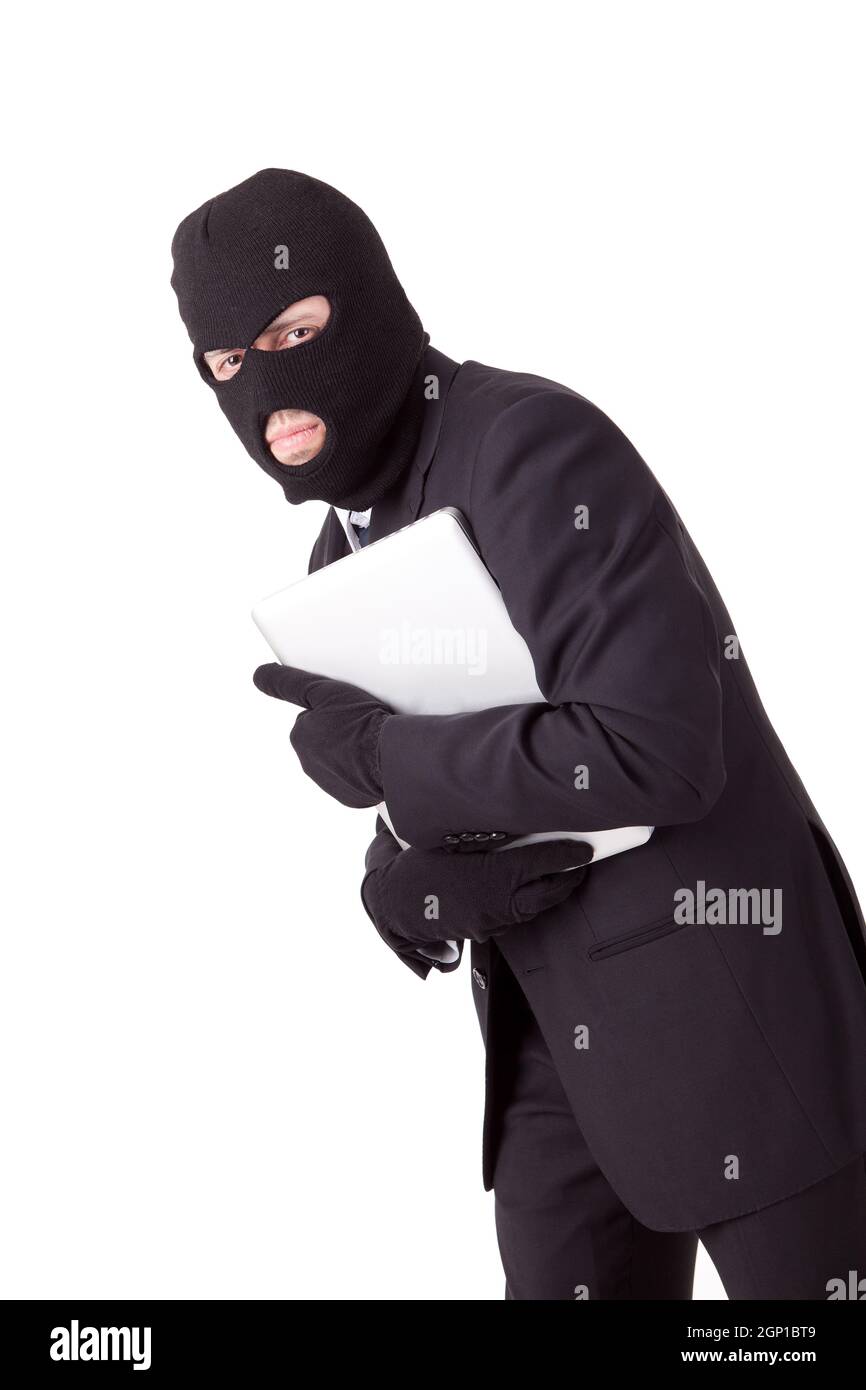 Disguised computer hacker hi-res stock photography and images - Alamy