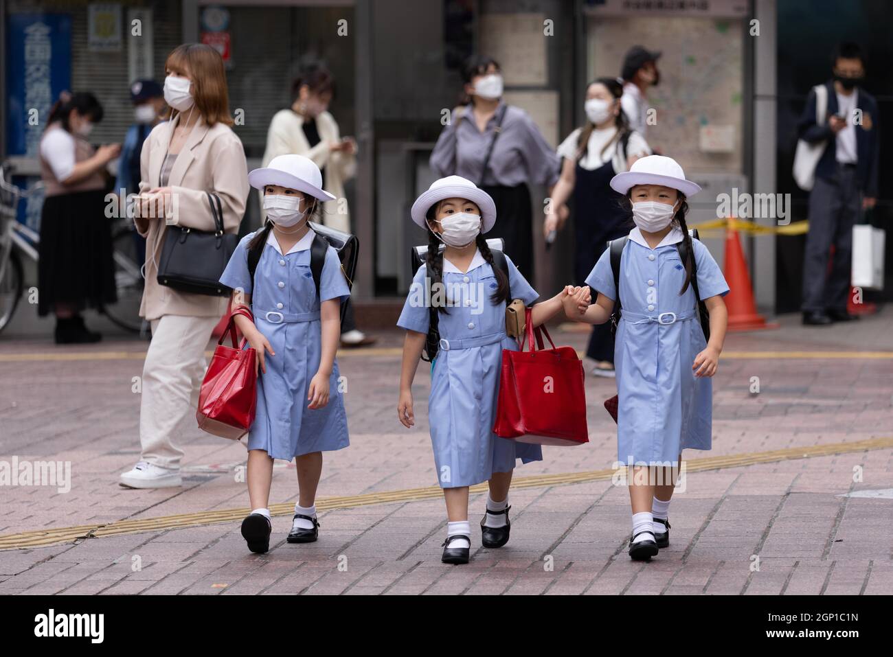 Tokyo, Japan. 27th Sep, 2021. School kids wearing masks as a preventive
