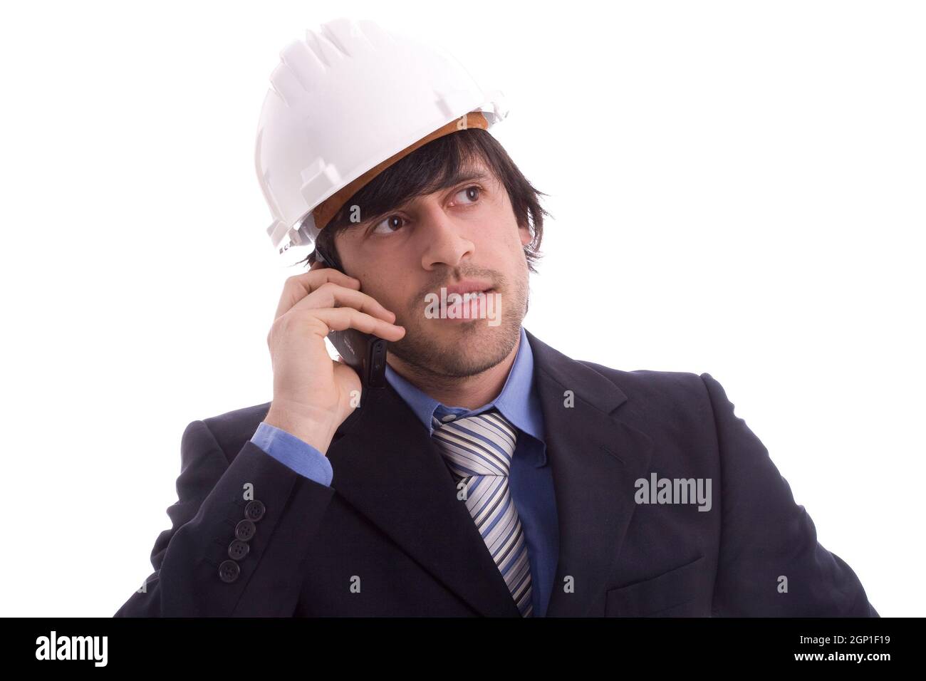 Young engineer on the phone, isolated on white Stock Photo