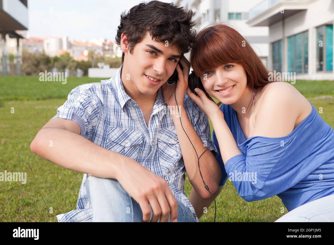 Young happy couple at the park Stock Photo - Alamy