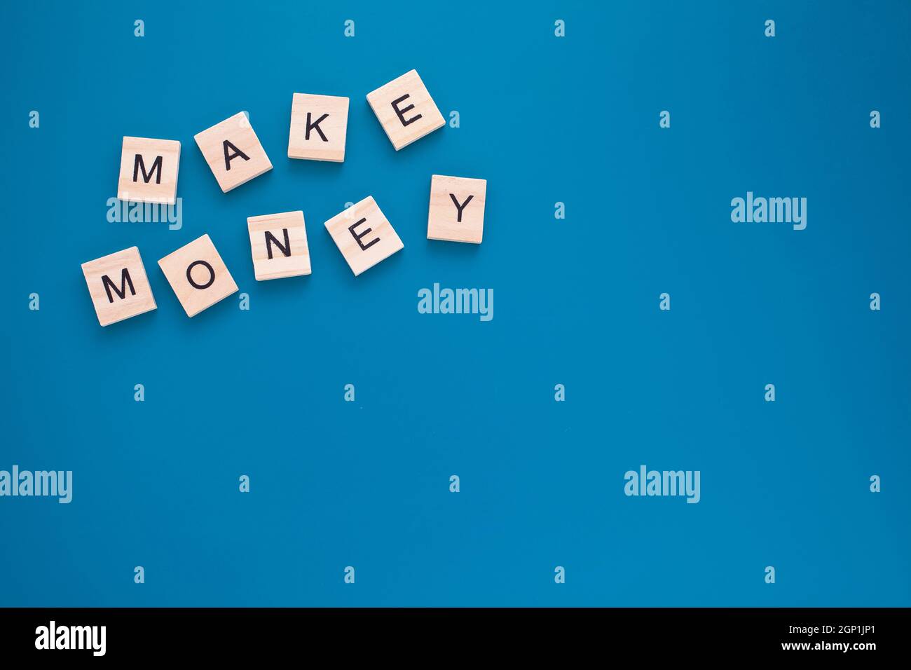 Wooden letters Make money Stock Photo - Alamy
