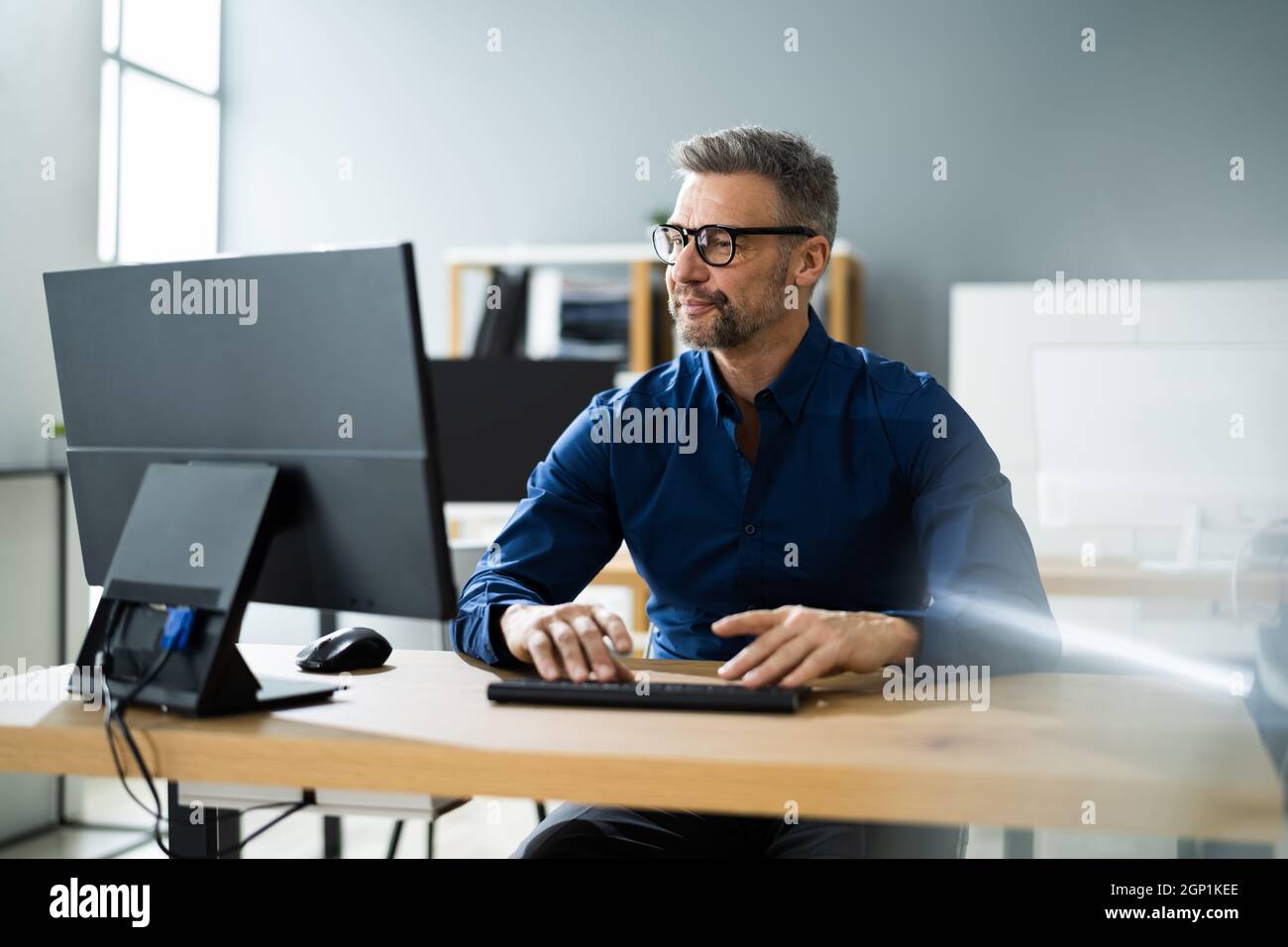 Businessman Using Business Computer In Office Or Workplace Stock Photo ...