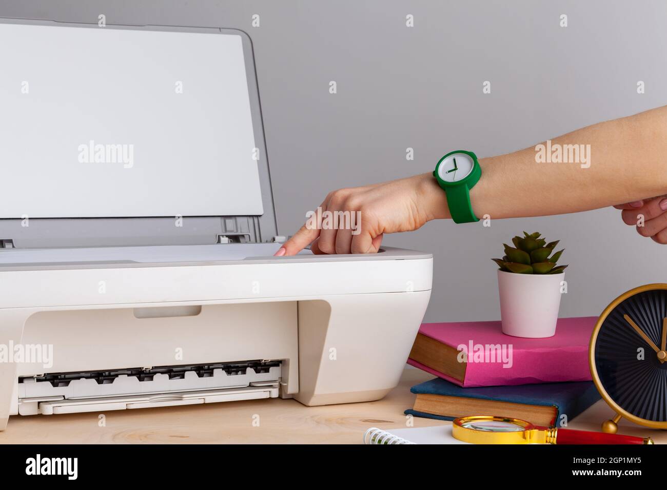 Close up of woman using a printer machine Stock Photo - Alamy