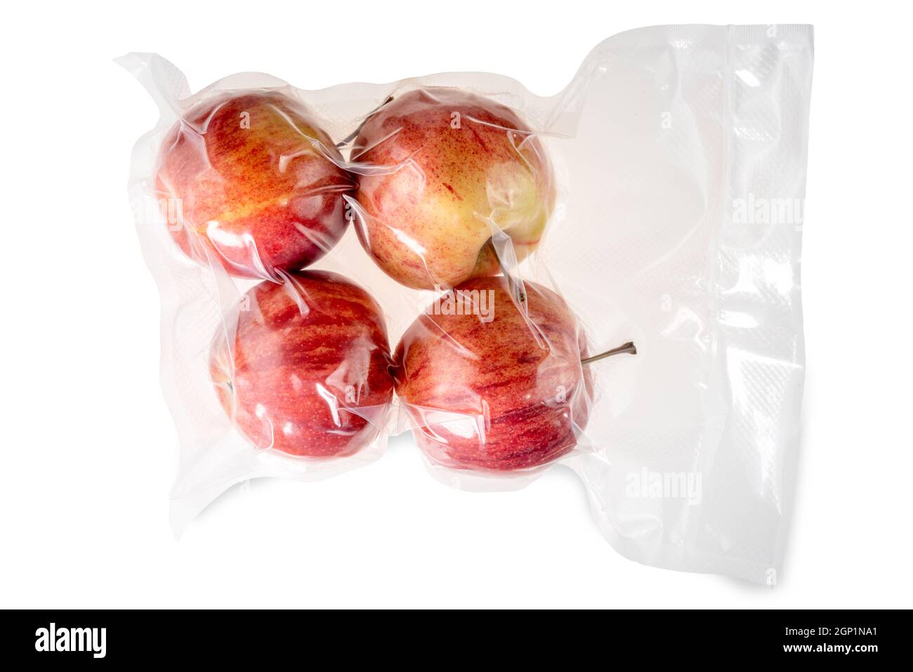 Four whole red apples in vacuum packed sealed for sous vide cooking isolated on white Stock Photo