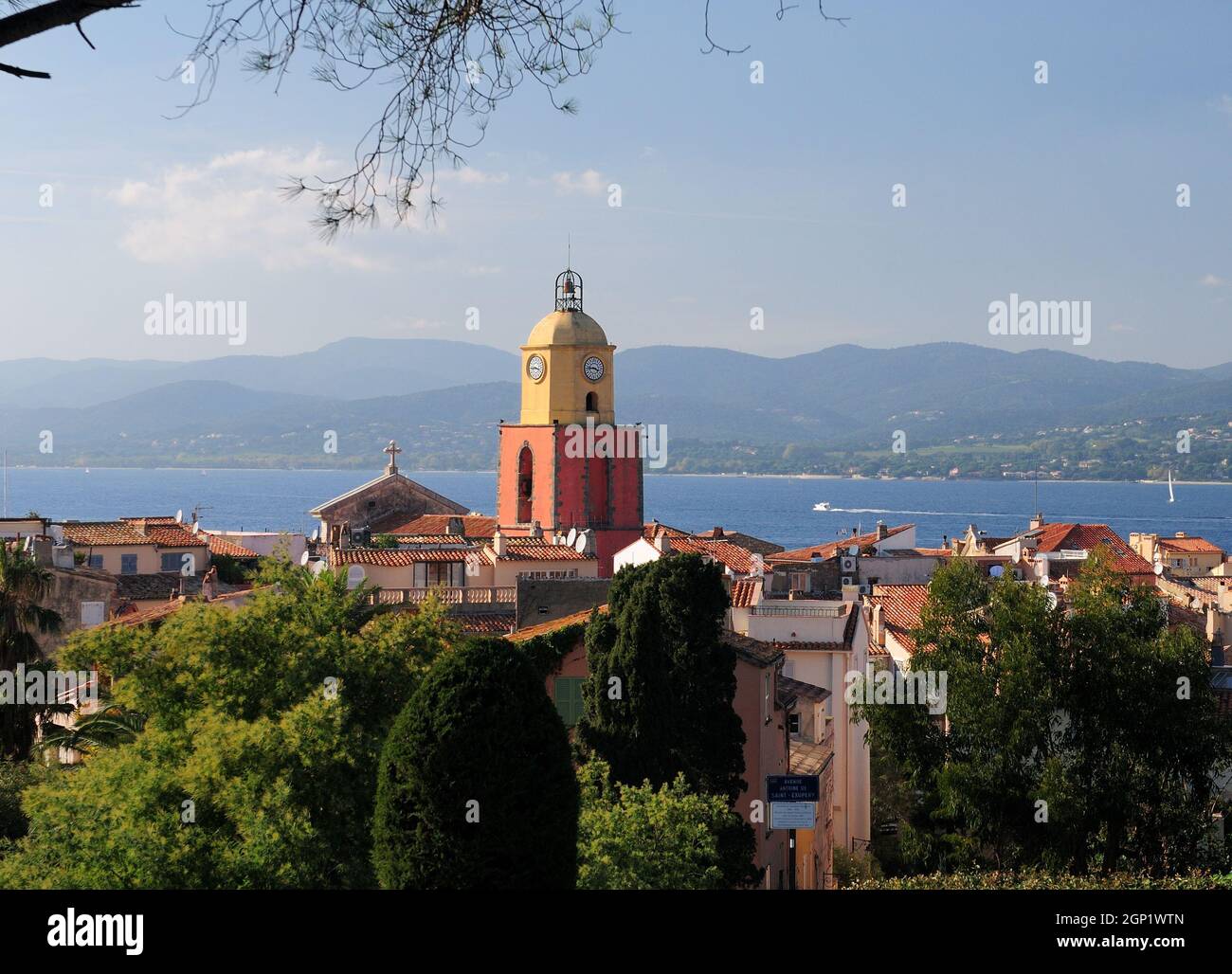Clock Tower In The Old Town Of Saint Tropez With The Bay In The Background In Preovence France On A Beautiful Autumn Day With A Clear Blue Sky Stock Photo