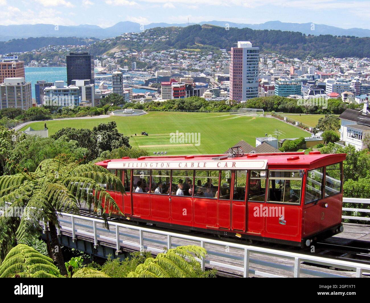 The iconic Wellington Cable Car transports people up from the Wellington Central Business District passing Kelburn Park while offering panoramic views of the city.  The funicular railway car has been in operation since 1902 carrying passengers from Bambto Quay in the Wellington CBD up to the suburb of Kelburn. Stock Photo