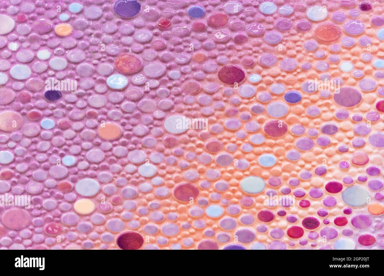 Lilac-yellow ceramic tiles with multi-colored ovals. Stock Photo