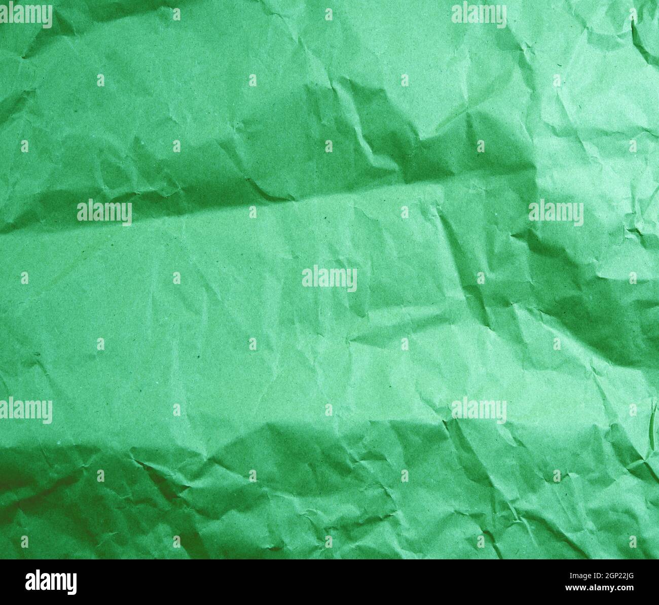 green crumpled paper, full frame, close up Stock Photo