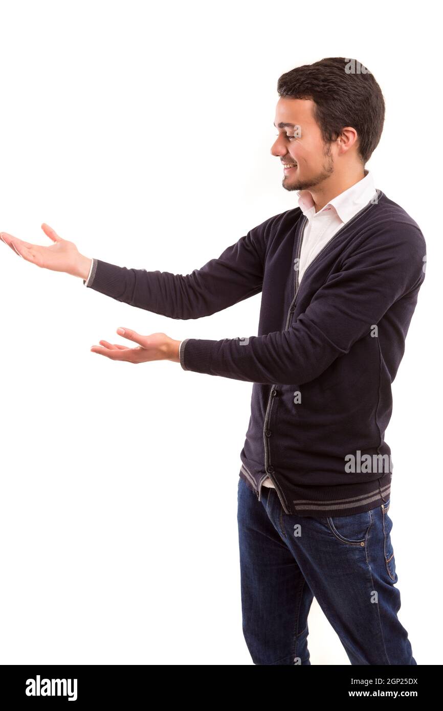 Young man presenting your product, isolated over a white background Stock Photo