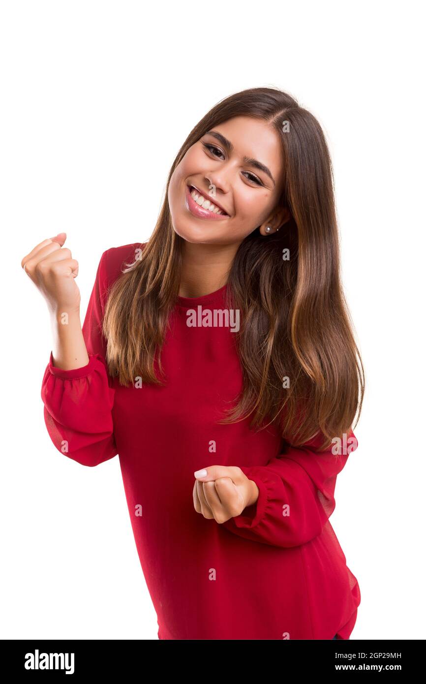 Studio shot: Happy woman with raised arms Stock Photo - Alamy