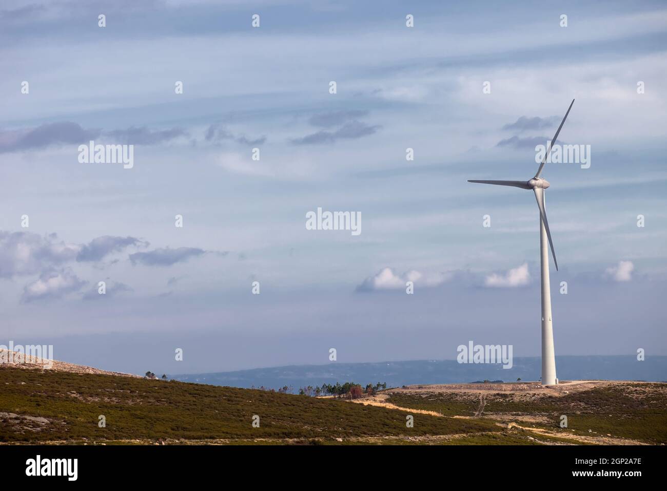 Wind energy turbines, in a landscpae over a beautiful blue sky Stock ...