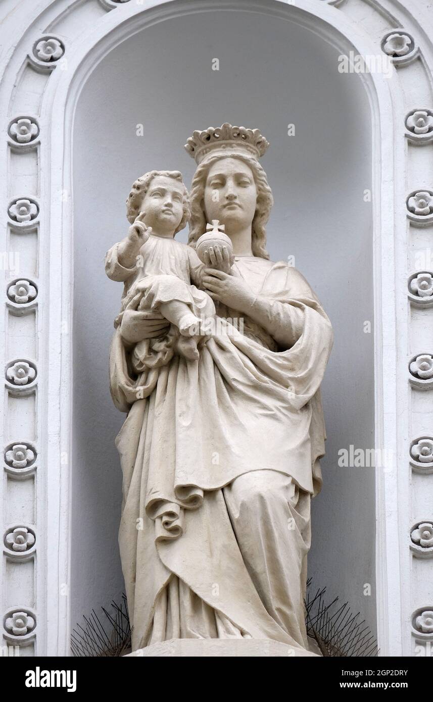 Virgin Mary with baby Jesus, statue on the house facade in Graz, Styria ...