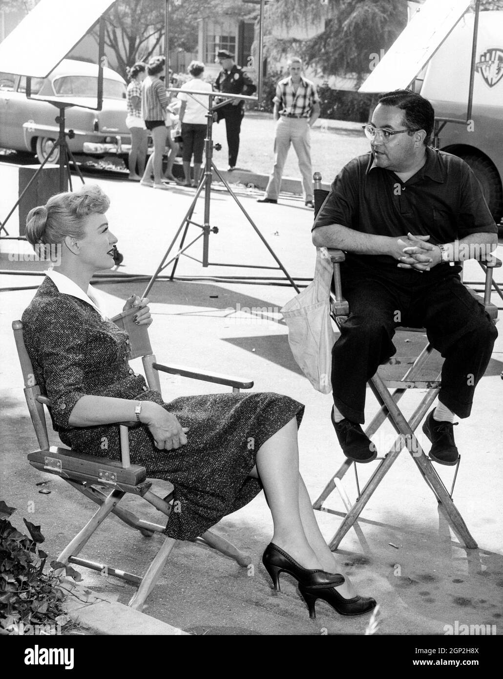 OUR MISS BROOKS, from left: Eve Arden, director Al Lewis, on location, 1956 Stock Photo