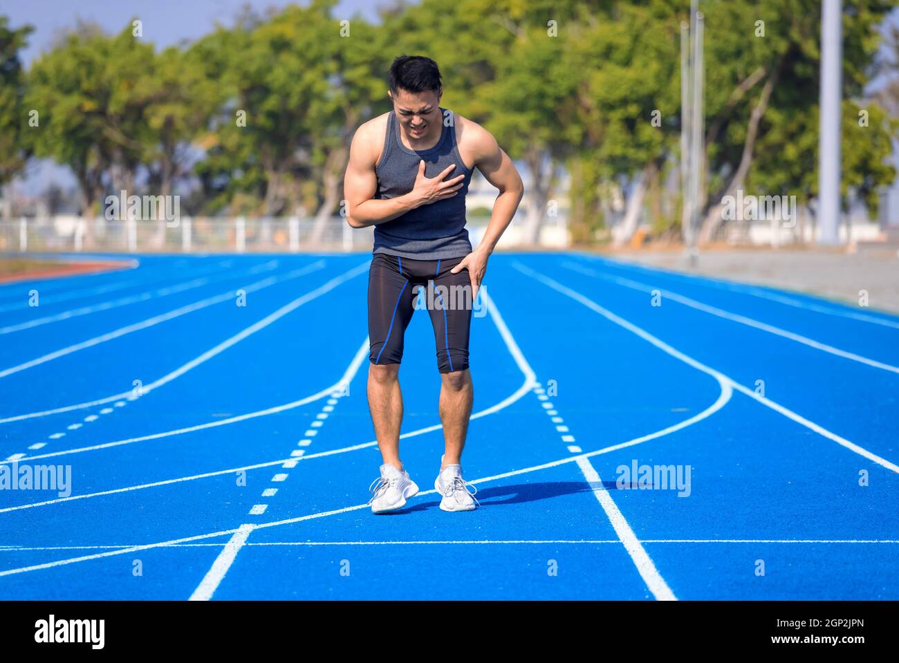 Male runner athlete chest injury and pain Stock Photo Alamy