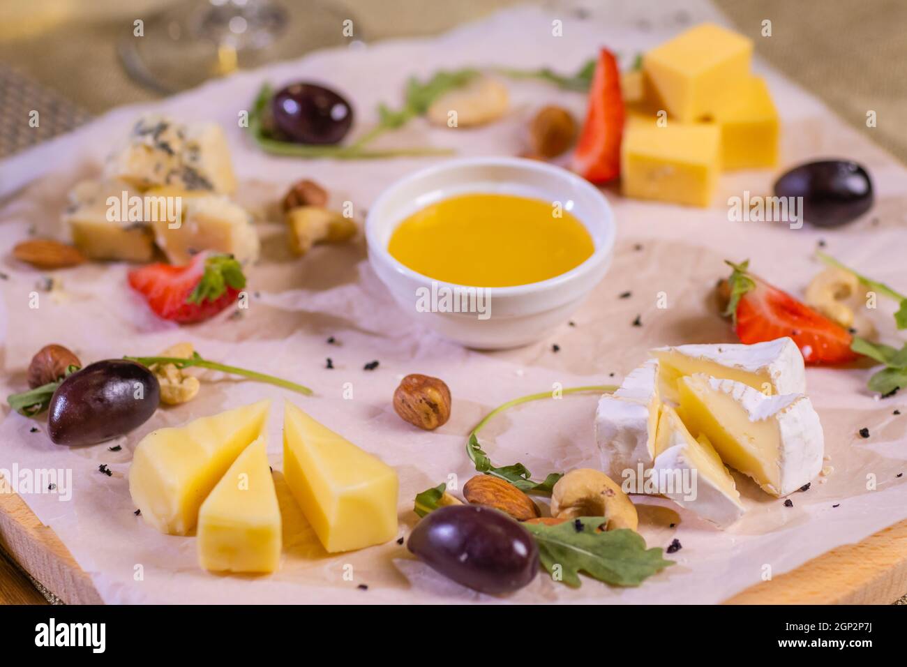 Cheese plate with cheeses Dorblu, Parmesan, Brie, Camembert and