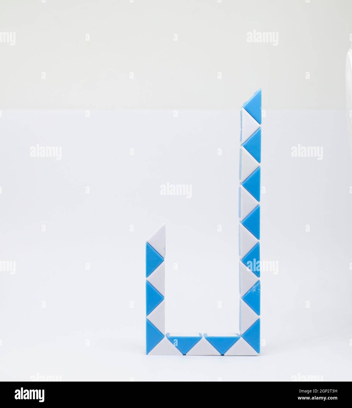 Letter 'j' made of and white triangles on a white background. Stock Photo