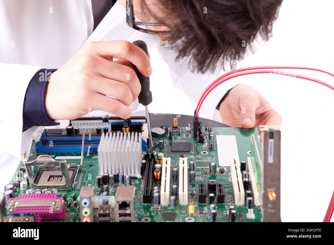 Computer engineer working on a old motherboard Stock Photo - Alamy