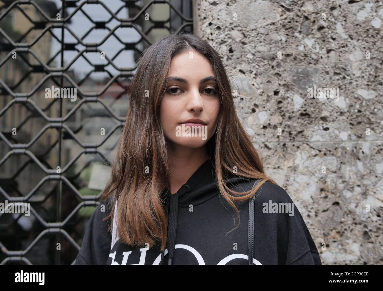 Model Talia Ferralis posing for photographers during Milano fashion week after fashion show. Stock Photo