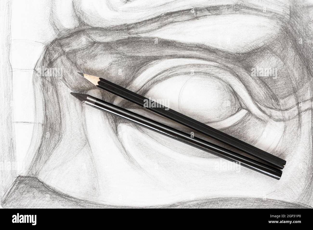 top view of set of black graphite pencils on hand-drawn academic