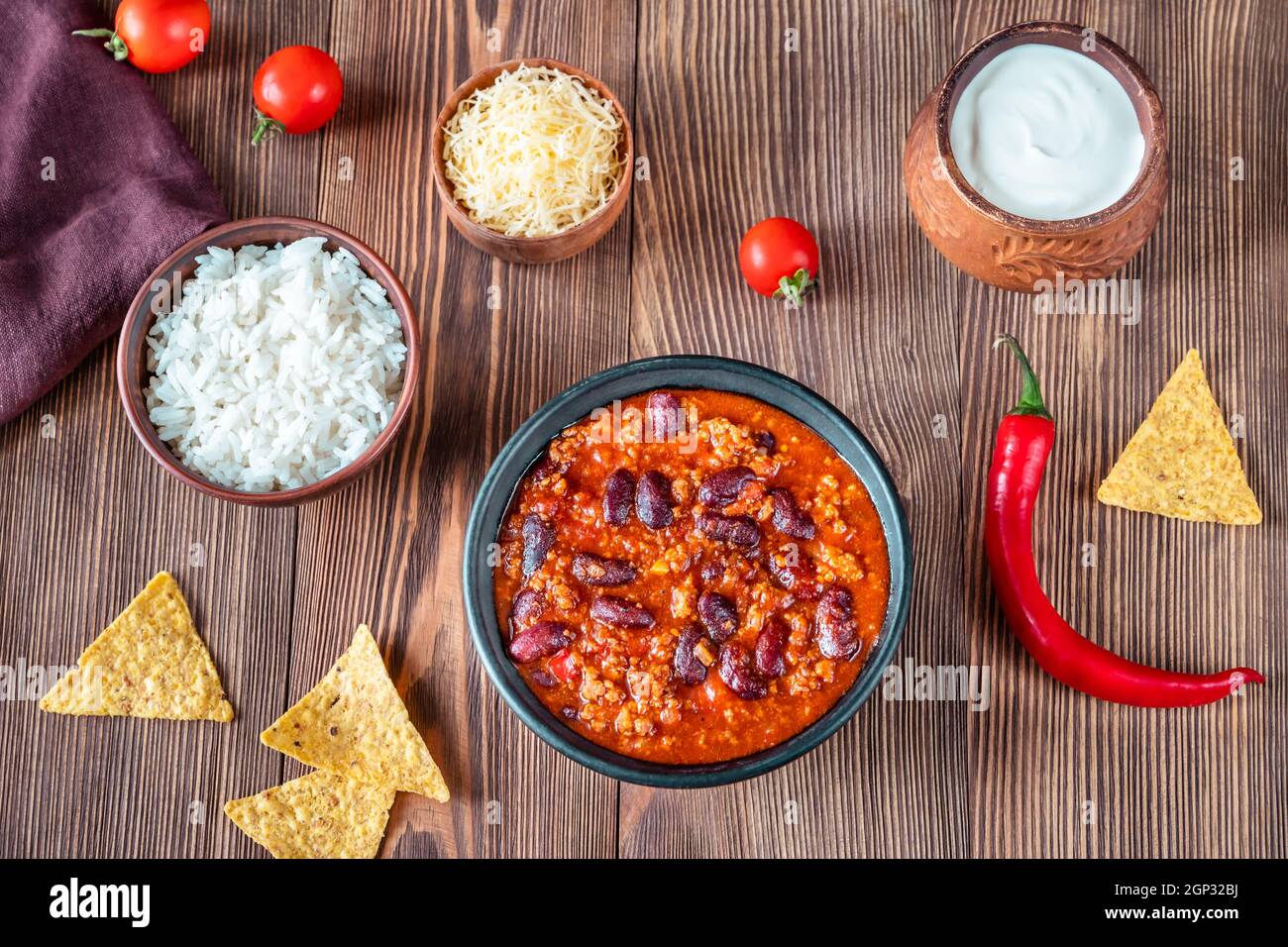Bowl of chili con carne with ingredients Stock Photo Alamy