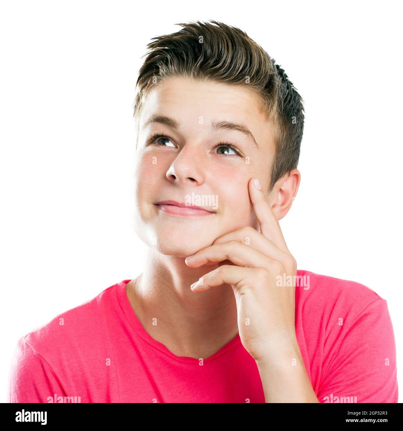 Close up portrait of Handsome teen boy looking at corner isolated. Stock Photo