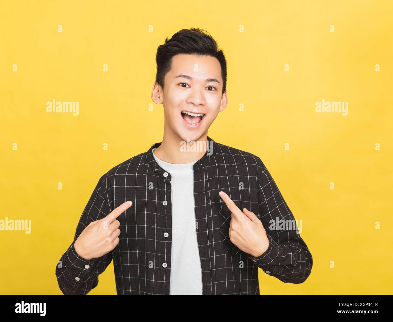young man smiling and pointing at himself Stock Photo Alamy