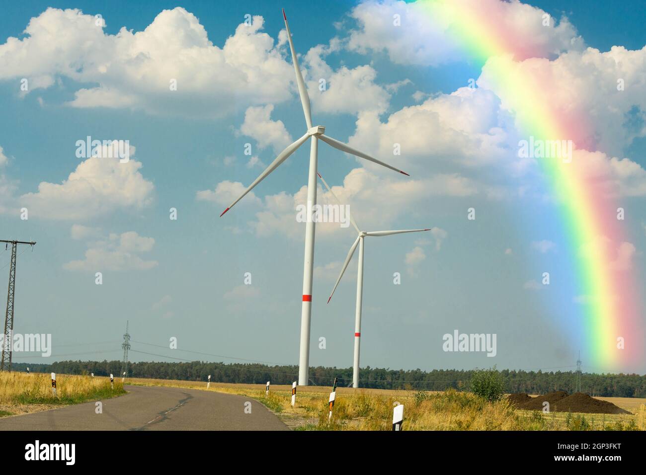 Sustainable green energy. Electric windmill generators in the sunrise Stock Photo