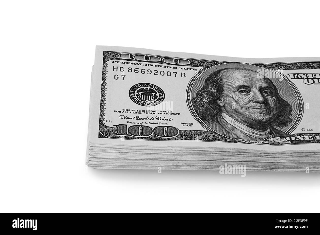 A large stack of hundred-dollar cash bills on a white background. Isolated. Layout, mockup, place for lettering and logo. Stock Photo