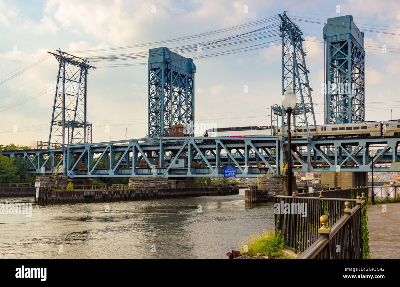 Newark, NJ - September 11, 2013: NJ Transit train crosses the Newark Drawbridge over the Passaic River in New Jersey Stock Photo