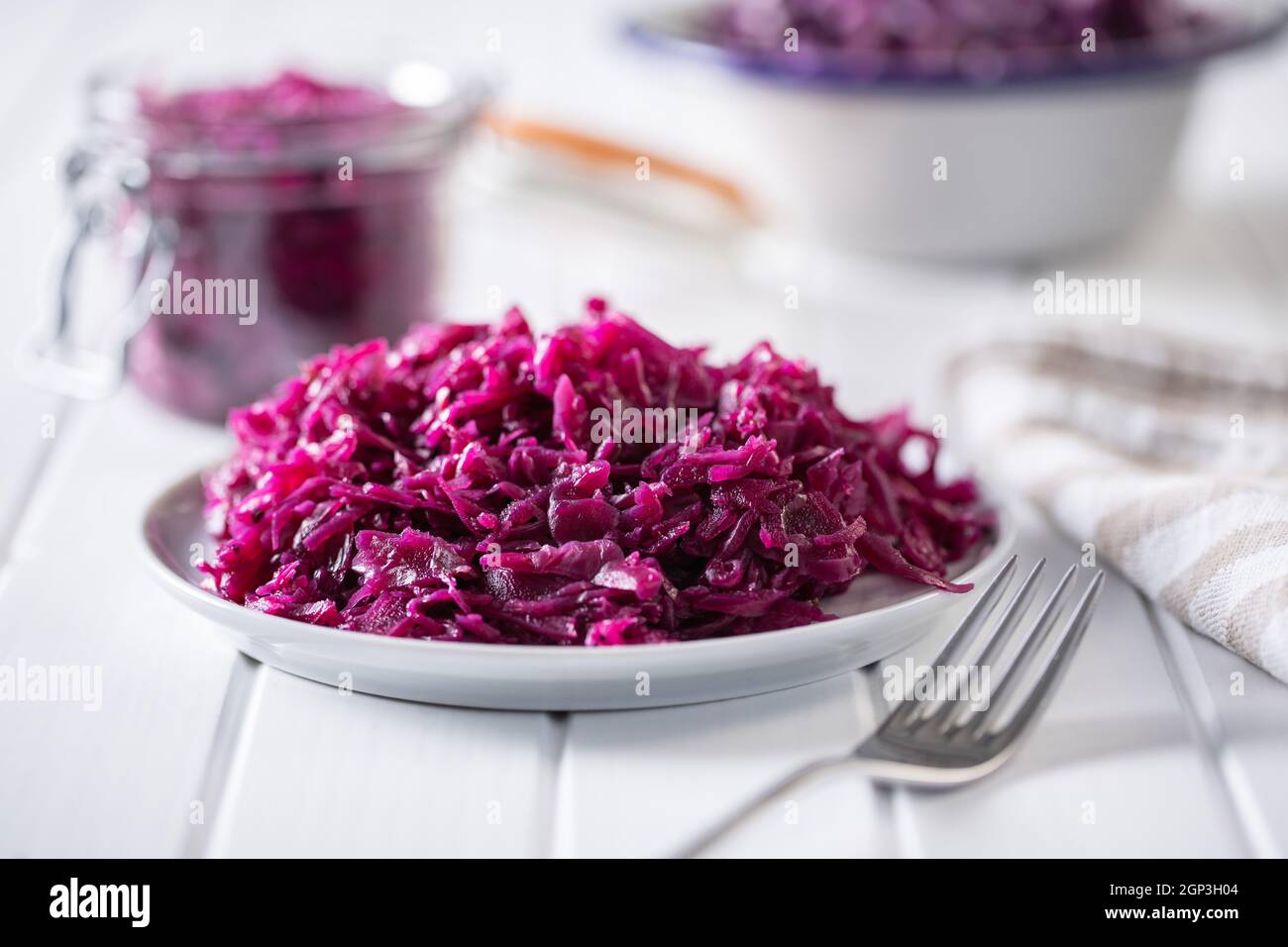 Red sauerkraut. Sour pickled cabbage on plate. Stock Photo