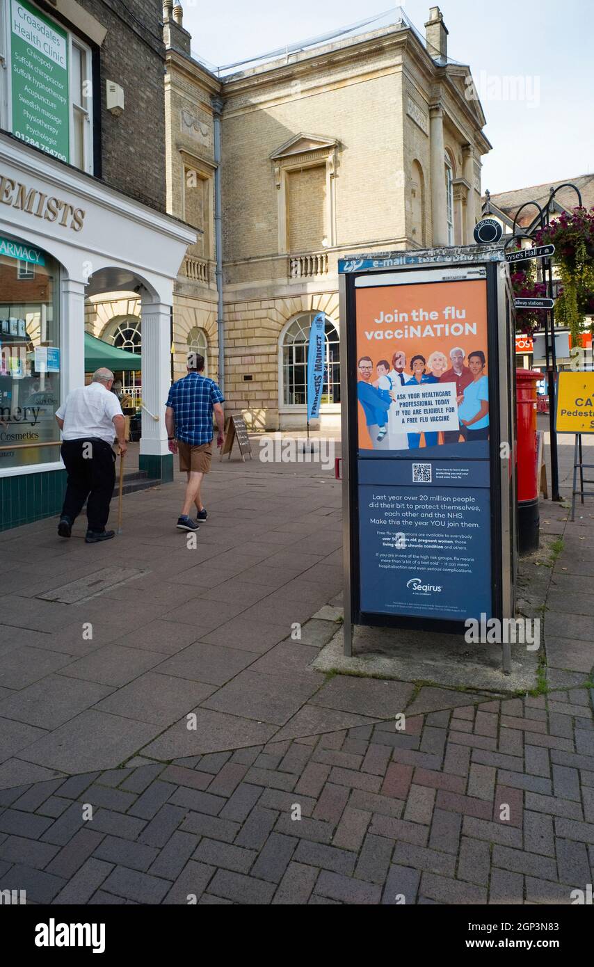 A side of phonebox advert in Bury St Edmunds for flu vaccinations in the autumn of 2021 Stock Photo
