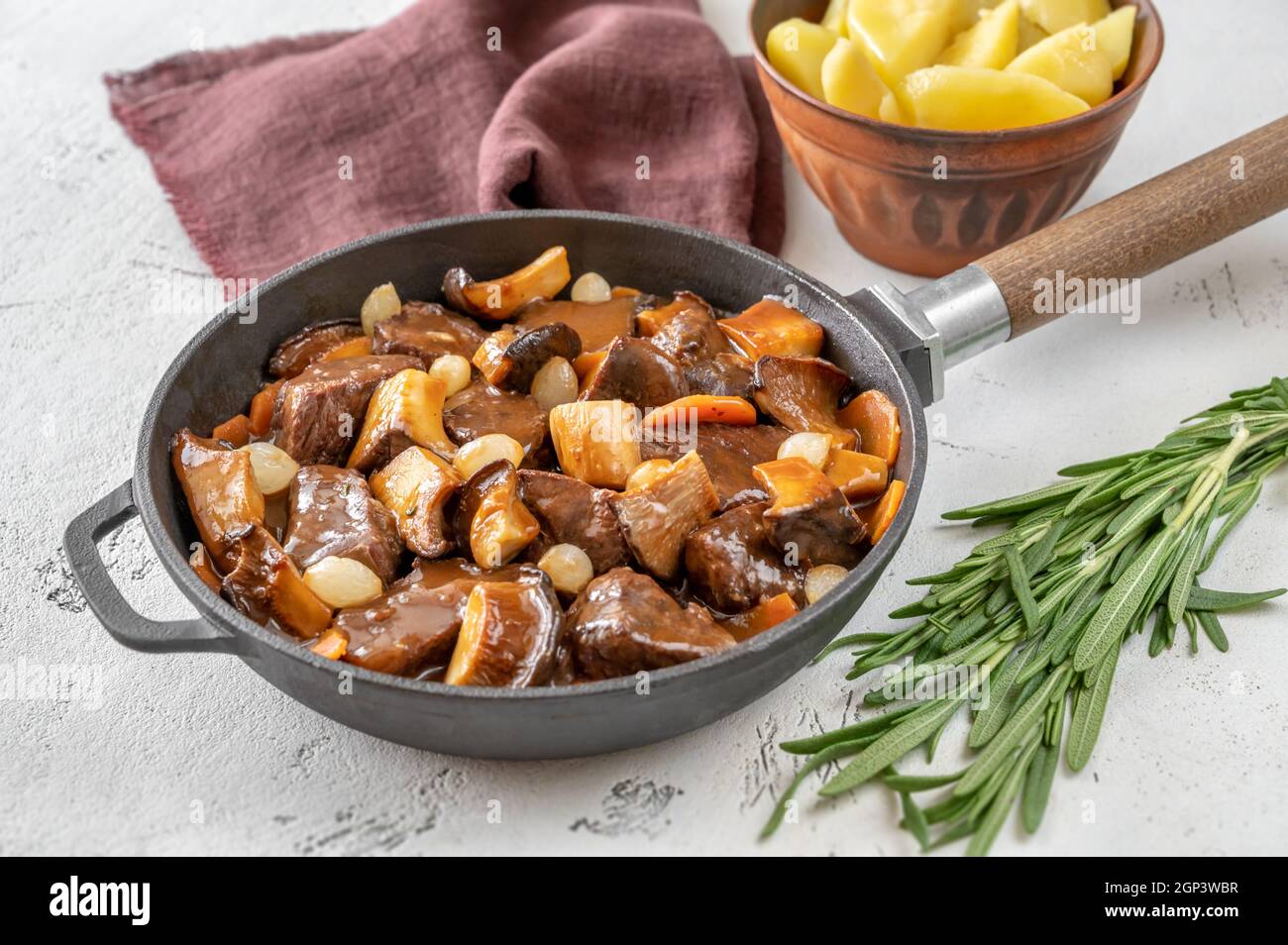 Beef bourguignon French beef stew in the skillet Stock Photo Alamy