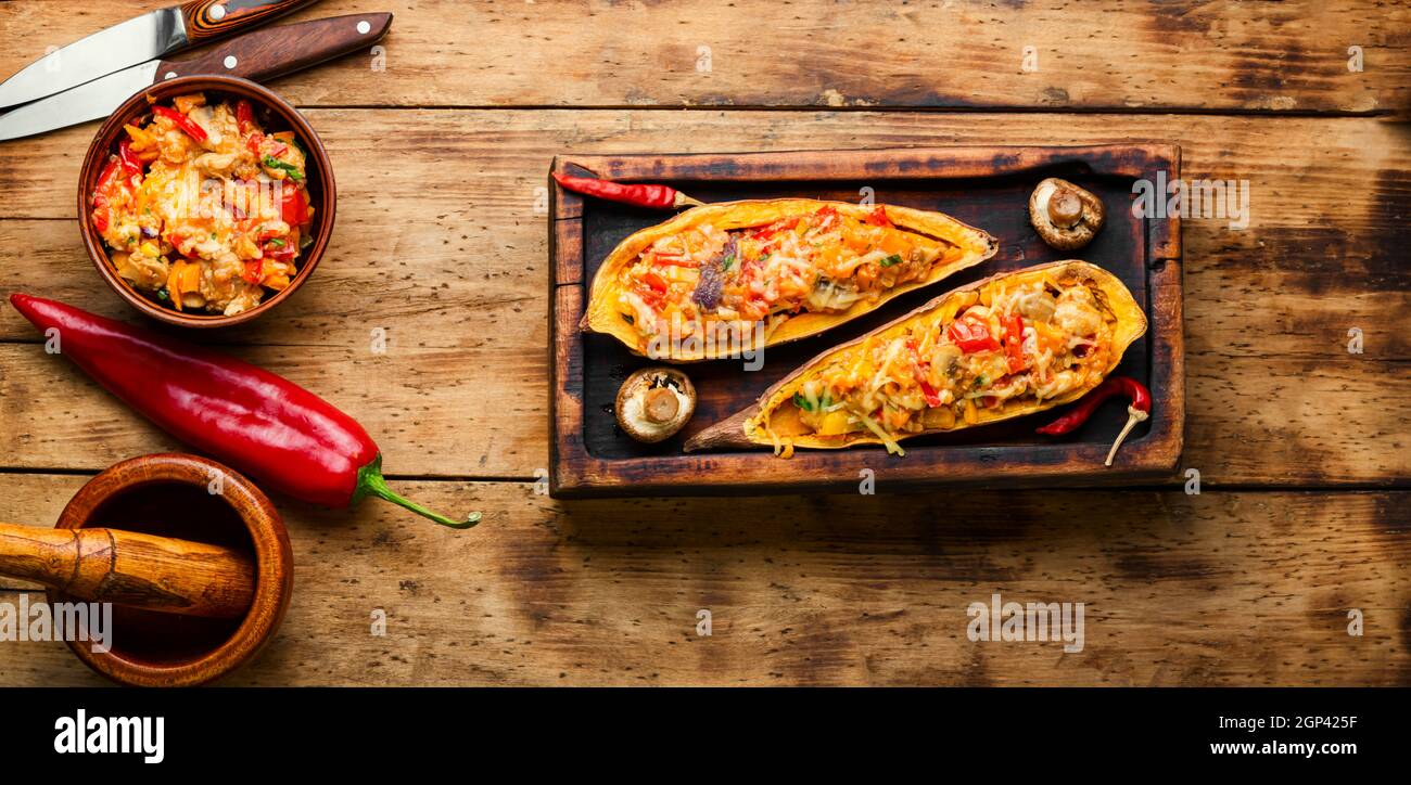 Baked yam with peppers,quinoa and mushrooms.Batata halves stuffed with vegetables.Healthy food