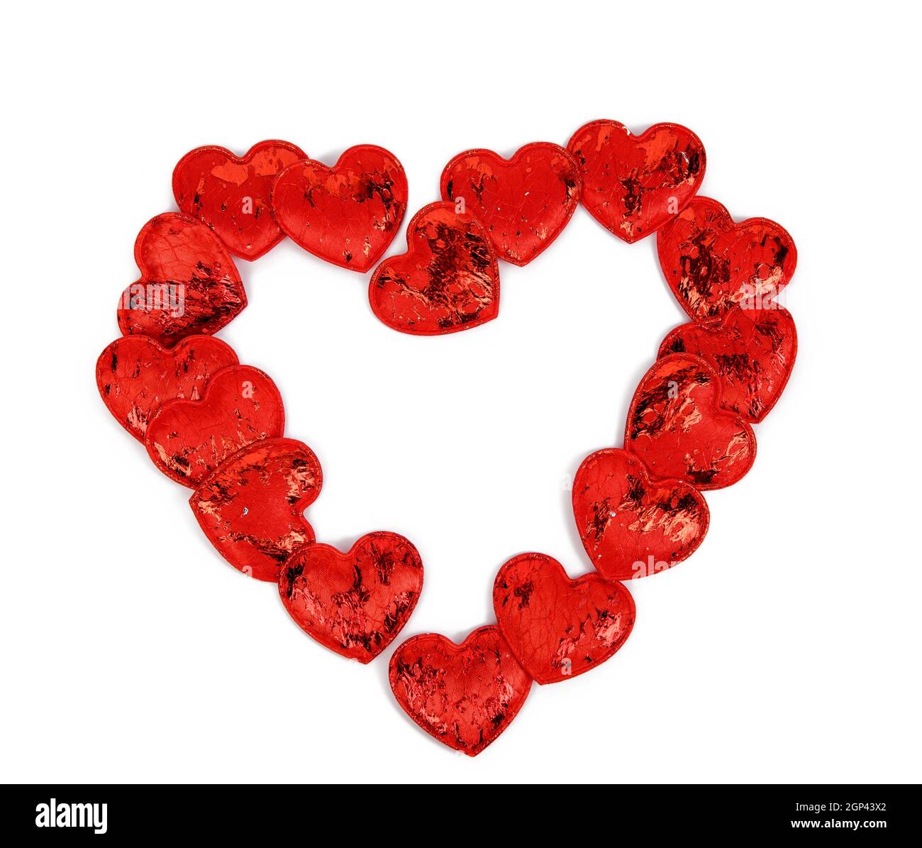 red textile small hearts on a white background, festive background ...