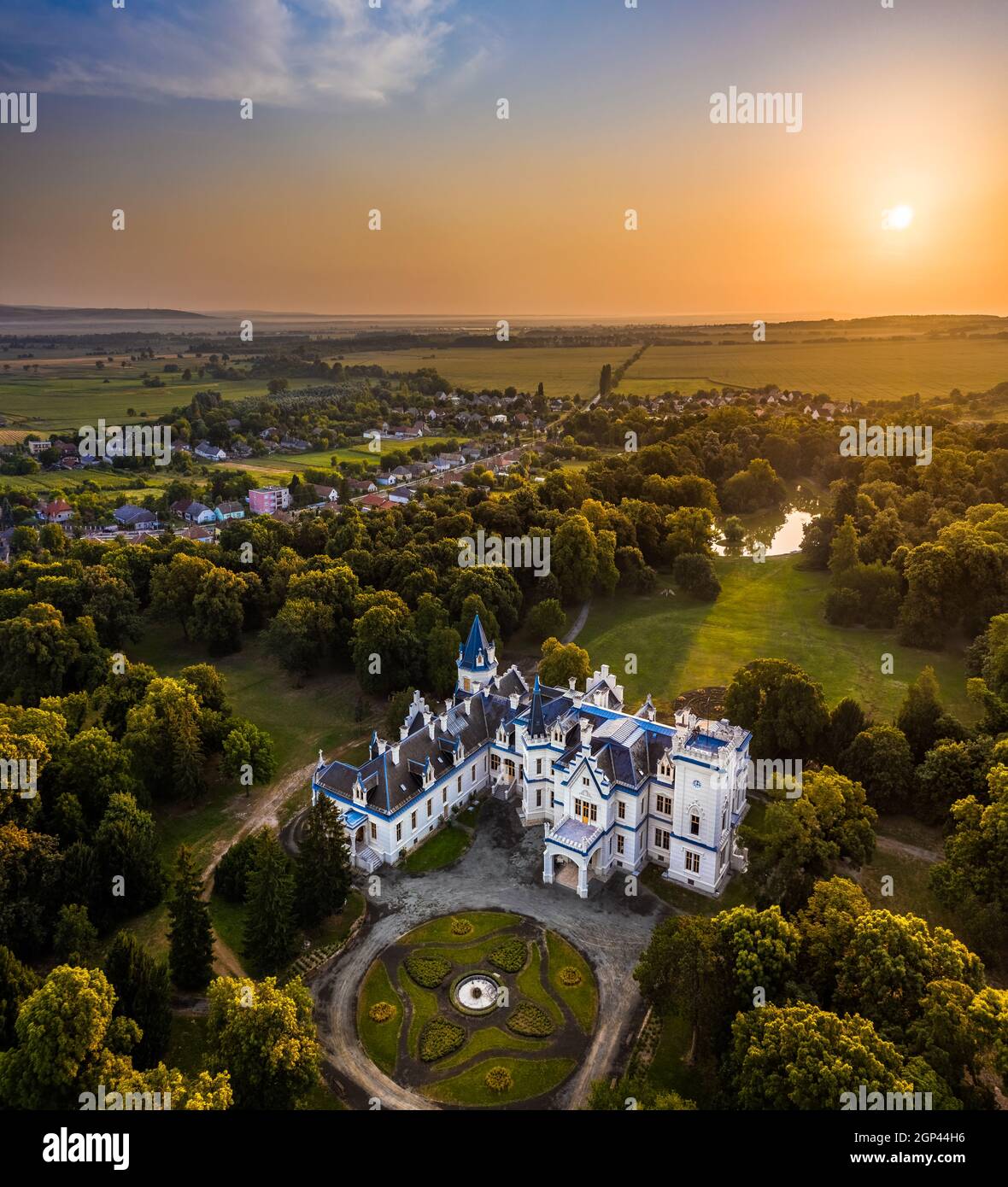 Nadasdladany, Hungary - Aerial view of the beautiful renovated Nadasdy Mansion (Nadasdy-kastely) at the small village of Nadasdladany with rising sun, Stock Photo