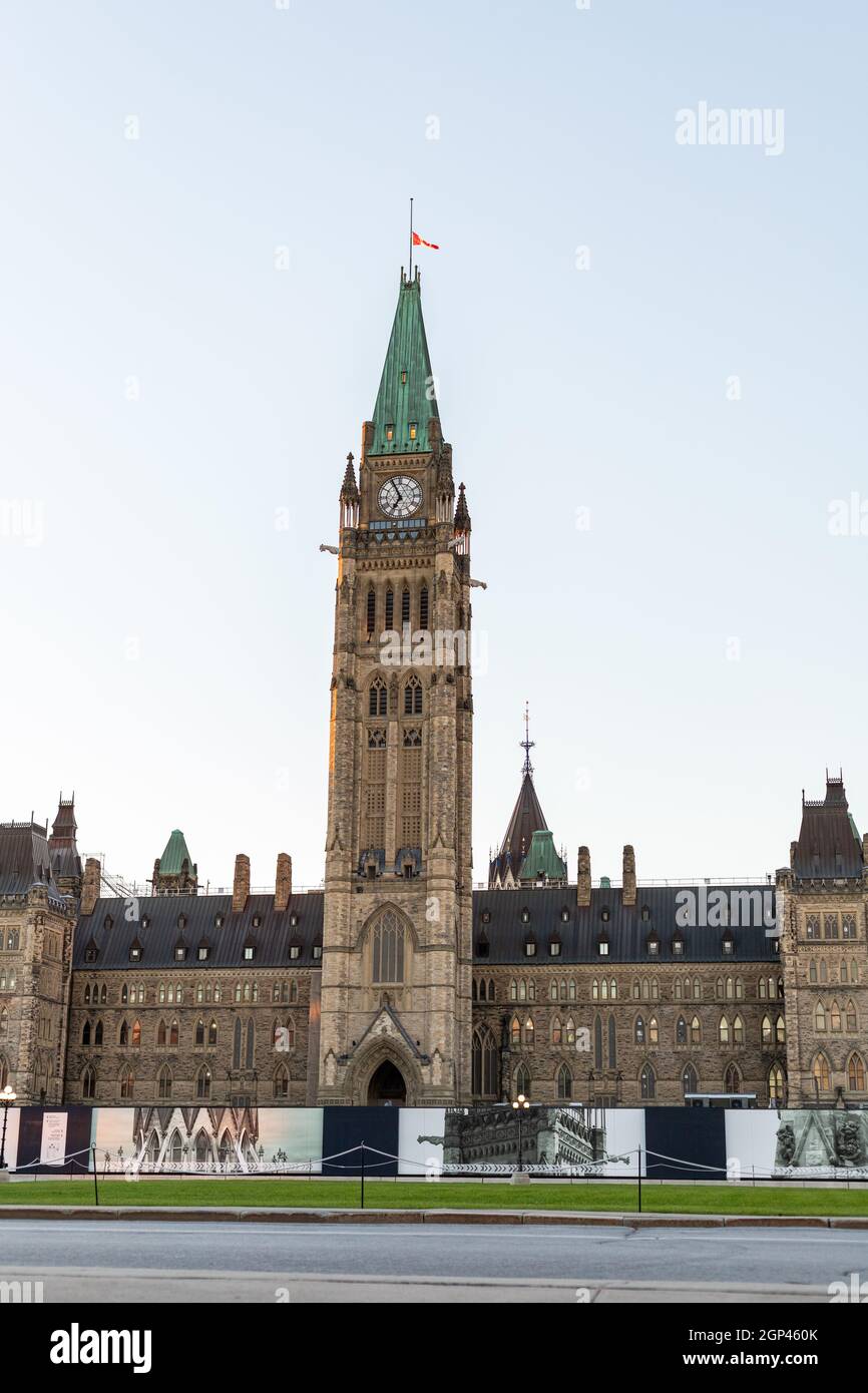 Ottawa, Canada - September 19, 2021: Parliament building with canadian flag in downtown of the capital Stock Photo