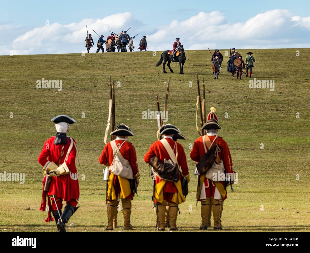 Hanoverian troops and the Jacobite army on the battlefield in re-enactment of Battle of Prestonpans, East Lothian, Scotland, UK Stock Photo