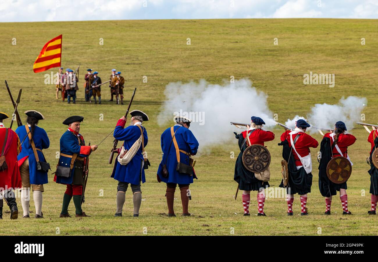 Hanoverian troops fire guns at the Jacobite army on the battlefield in re-enactment of Battle of Prestonpans, East Lothian, Scotland, UK Stock Photo