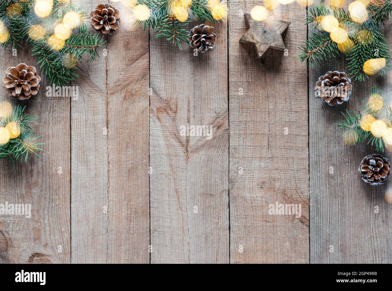 Christmas background with fir tree branches, pine cones, and Christmas ...
