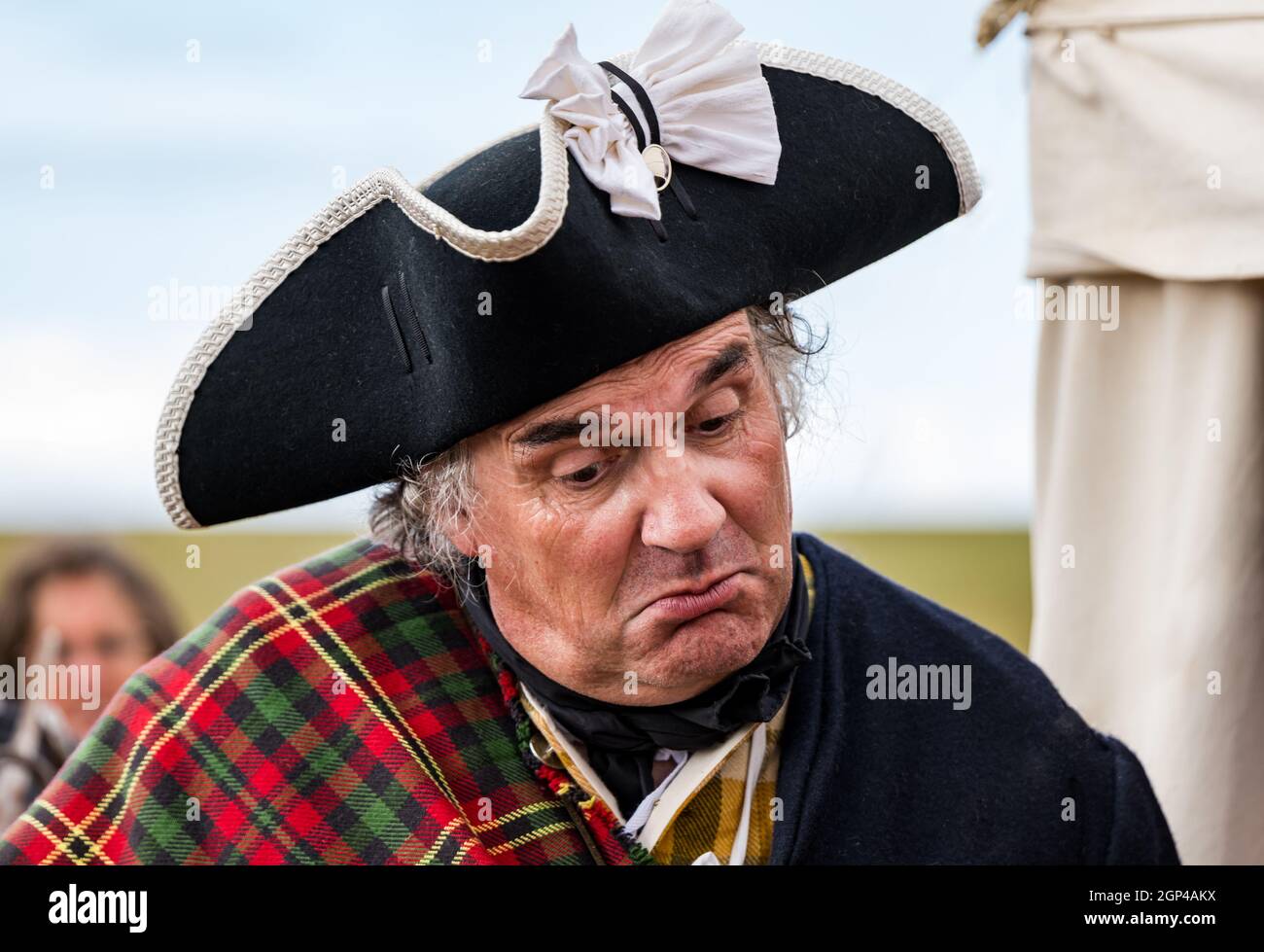 A Jacobite soldier in peripd costume with tricorne hat in re-enactment of Battle of Prestonpans, East Lothian, Scotland, UK Stock Photo