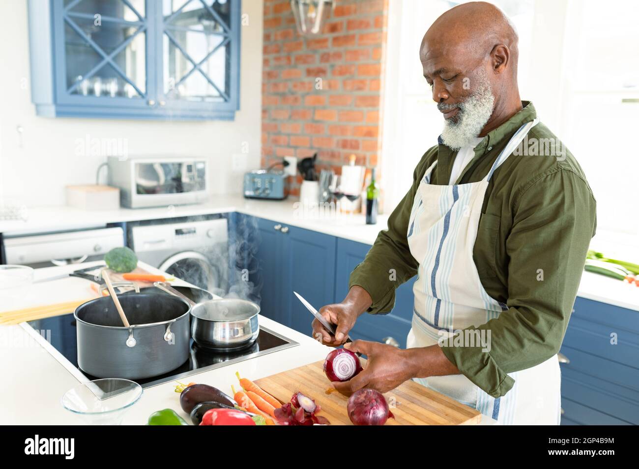 Man Wearing Apron and Cooking Stock Photo - Image of preparing, healthy:  31670526